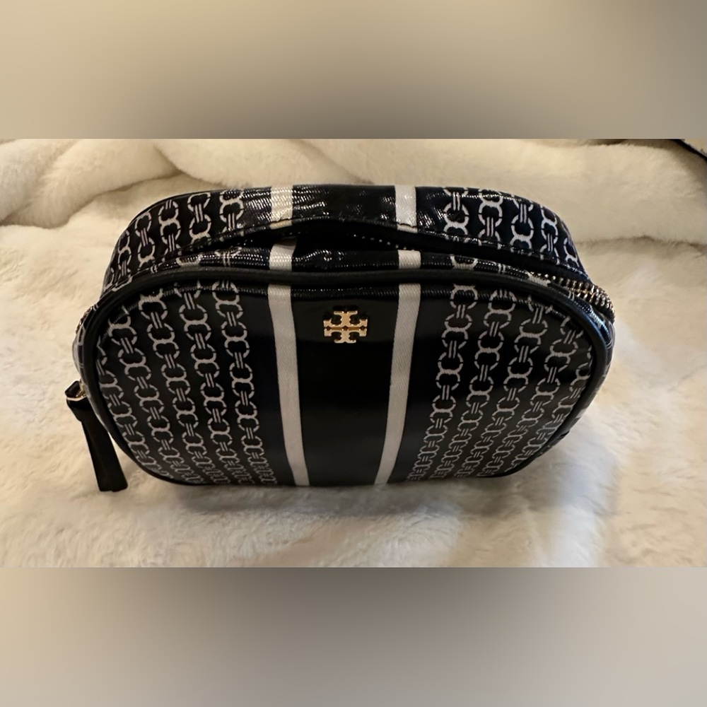 Tory Burch makeup case with zipper enclosure